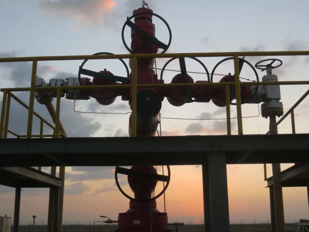 Offshore rig at sunset, illustrating well intervention, completion and drilling equipment