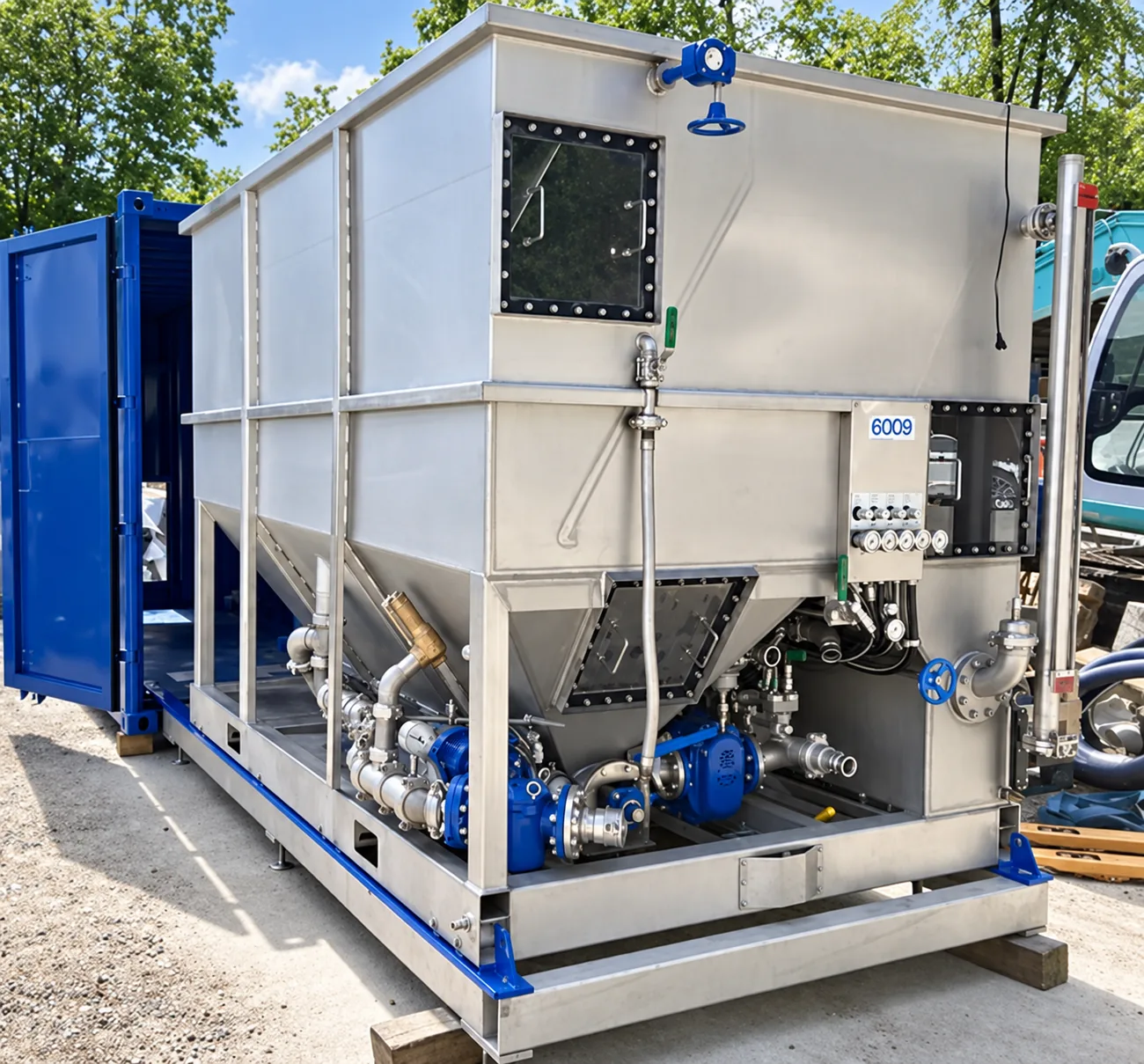 Containerised stainless steel water treatment and separation unit with pumps and valves